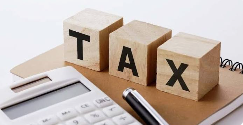 Tax blocks with a calculator and pen